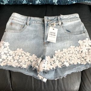 Urban Heritage denim shorts with lace trim